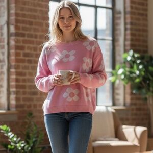 Stay cozy and stylish with this charming pink floral sweater. Perfect for any ca